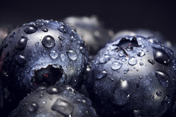 A close up photo of blueberries