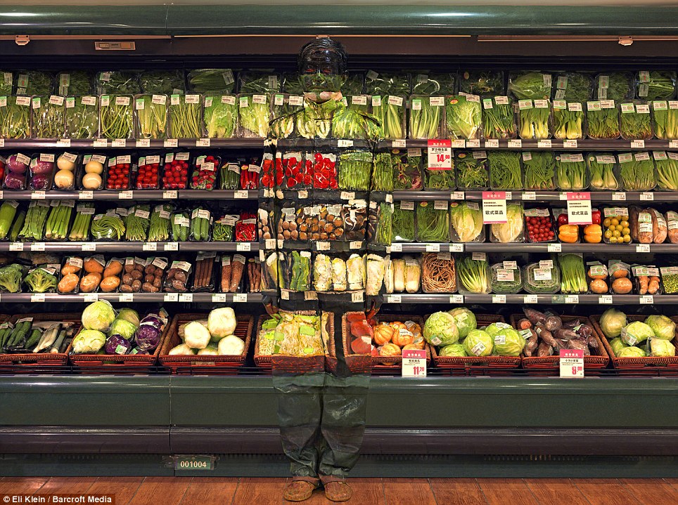 Disappearing act: No matter how complex the backdrop, Liu Bolin manages to become virtually invisible to the naked eye
