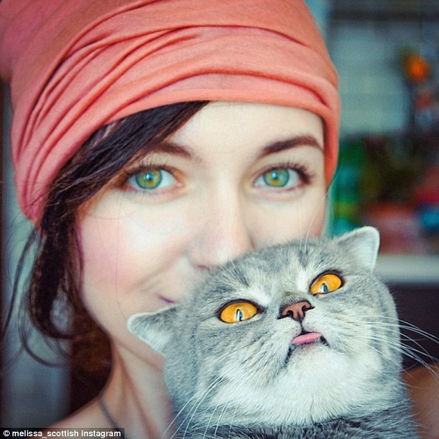 It is unclear exactly why Melissa has this particular habit, but her whimsical portraits, taken by her Russia-based owner Alina Esther (pictured), are proving rather popular