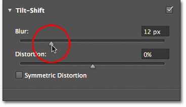 Dragging the Blur slider in the Blur Tools panel.